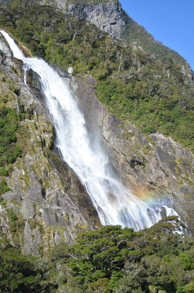 Water fall with a partial rainbow