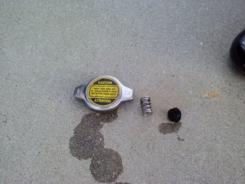 ... then it would have caused steam vapors to escape through the unpressurized cap which would eventually result in the low coolant level.